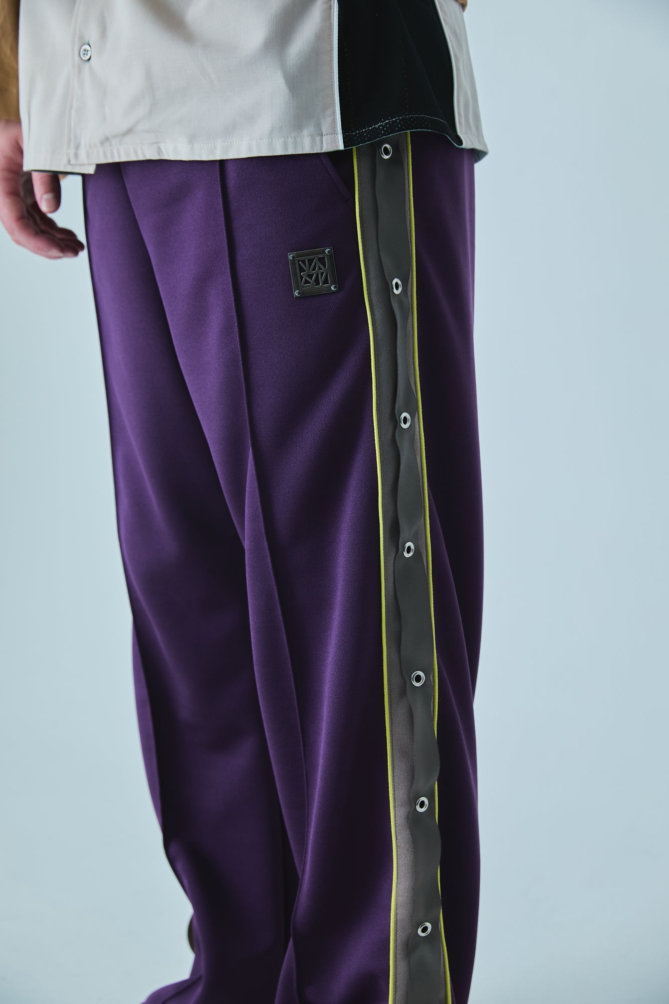 EYELET TRACK PANTS